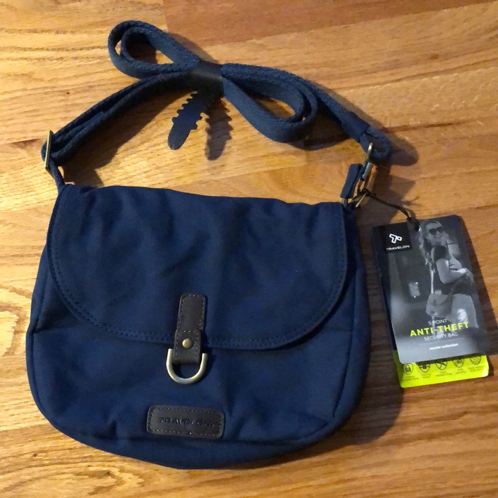 Travelon- Anti-theft courier saddle crossbody